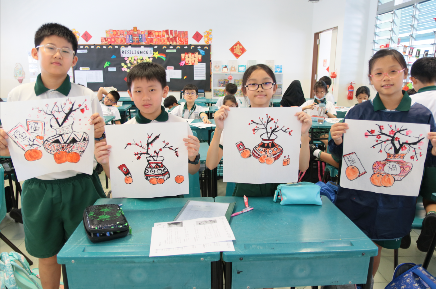 Students proudly displaying their Chinese ink paintings